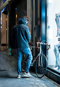man beside of road bike thumbnail