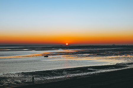 photo of body of water during golden hour thumbnail