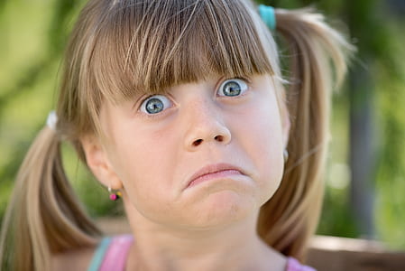close up photo of girl wearing pink top thumbnail
