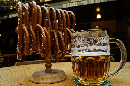 beer mug beside on cookies with stand on table thumbnail