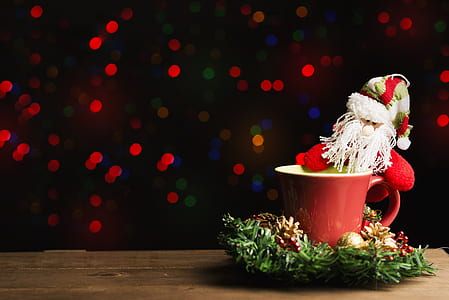 Santa Claus figurine in red ceramic cup thumbnail