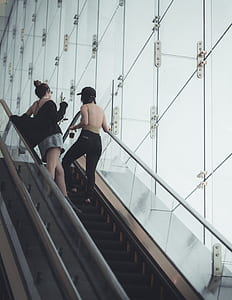 women standing on escalator thumbnail