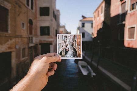 person holding photo of Bridge of Sigh thumbnail