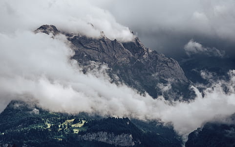 bird's-eye view photography of mountain surrounded by clouds thumbnail