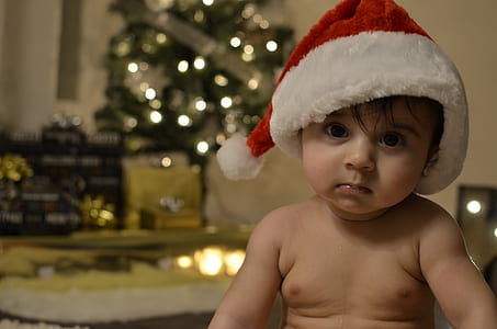 toddler wearing Christmas hat thumbnail