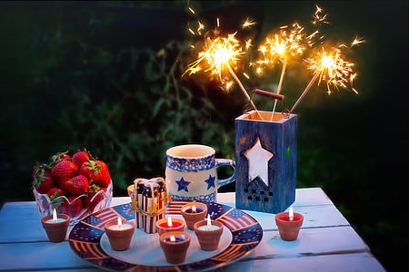 still-life photography of candles and fire crackers thumbnail