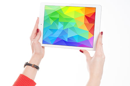 woman holding white tablet thumbnail