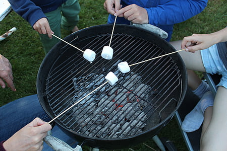 four person grilling white mushroom in stick thumbnail