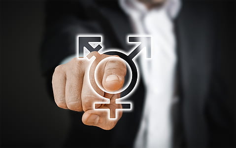 person pointing with gender sign thumbnail
