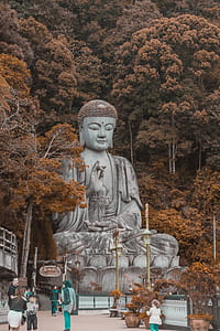 people near gray Buddha statue thumbnail