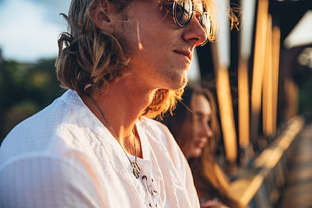 Young Man Watches Sunset Photo thumbnail