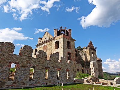 brown concrete castle under white and blue sky during daytime thumbnail