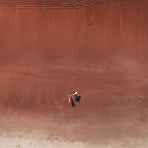 two person standing on desert thumbnail
