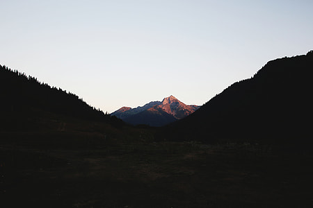 in distant photo of mountain peak thumbnail