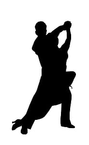 Silhouette of couple dancing together. thumbnail