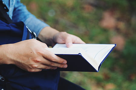 person holding book thumbnail