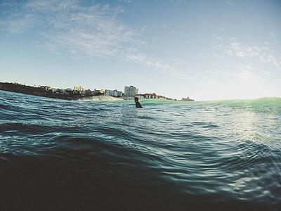 person swimming on the ocean thumbnail
