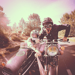 Photography of two person riding a standard motorcycle with sidecar thumbnail