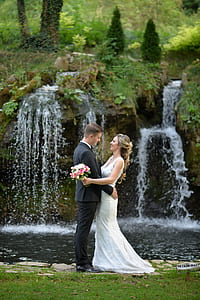wedding couple beside waterfalls thumbnail