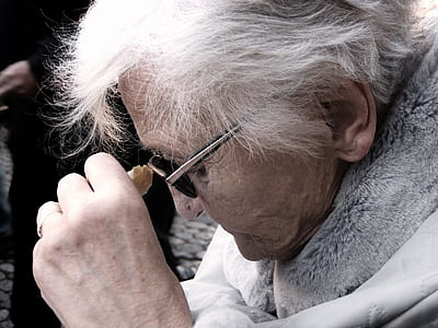 person wearing black sunglasses and gray fur coat thumbnail