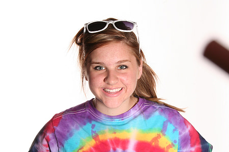 woman wearing purple and multicolored tie-dye crew-neck shirt thumbnail
