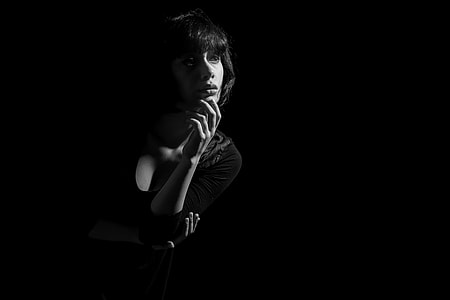 woman with fingers on chin thumbnail