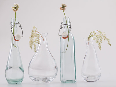 close-up photo of four clear glass vases thumbnail