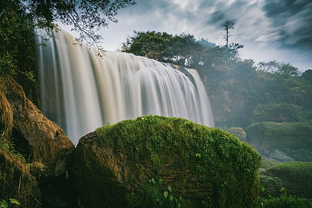 Photography of Waterfalls Surrounded by Trees thumbnail