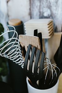 Kitchen utensils and cans by the wall thumbnail