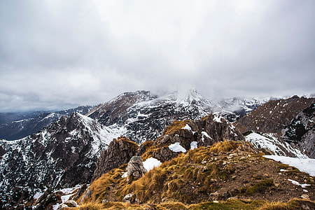 white, black and yellow mountain photo during daytime thumbnail