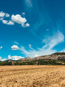 concrete building on mountain under blue sky during daytime thumbnail
