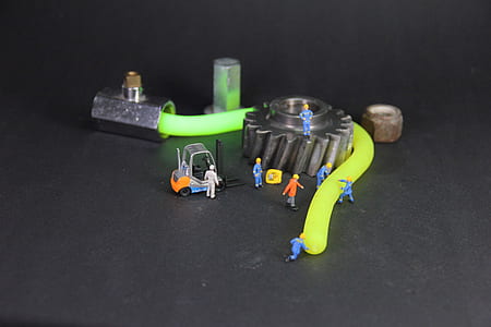 assorted-color plastic toys beside gear and cable thumbnail