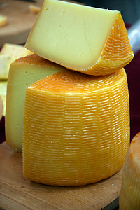sliced cheese on brown wooden surface thumbnail