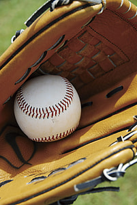 white baseball and brown baseball mitt thumbnail