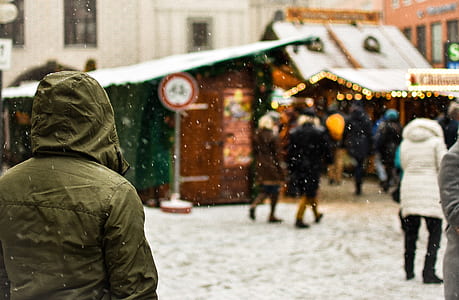 person standing on snow land near store thumbnail