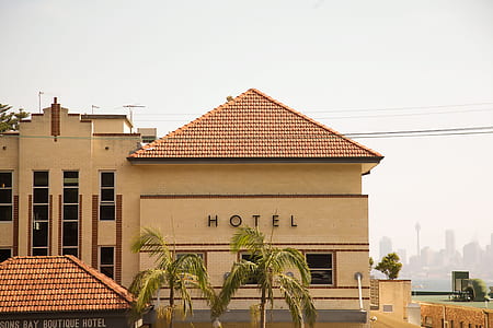 beige Hotel with brown roof tiles thumbnail