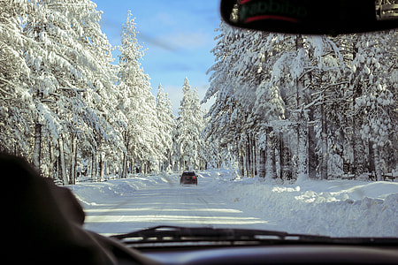 driving in road full of snow thumbnail