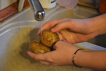 person cleaning potatoes thumbnail