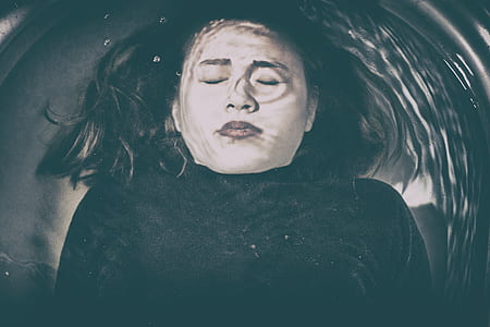 woman in black top underwater thumbnail