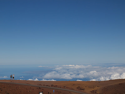 two people standing on top of a hill during daytime thumbnail