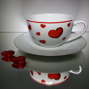 white and red heart-themed ceramic mug on saucer thumbnail