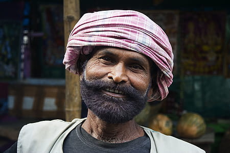 Man Wearing Pink Turban Headdress Smiling thumbnail