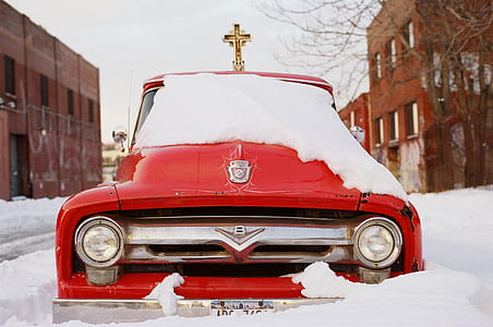 red car covered with snow thumbnail