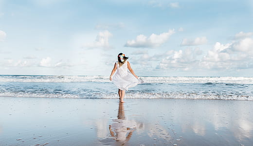 woman standing on seashore thumbnail