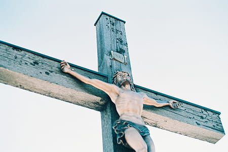 crucifix under white clouds thumbnail