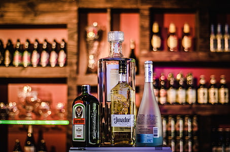 selective focus photography of several liquor bottles thumbnail