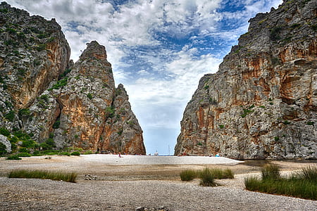 pathway in the middle of rock cliffs thumbnail