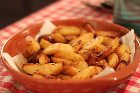 fried potatoes in bowl on table thumbnail