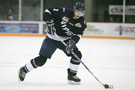man playing ice hockey thumbnail