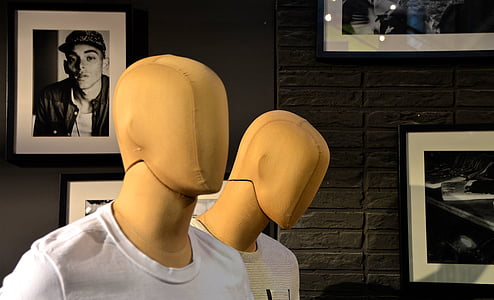 two mannequins near black wall thumbnail